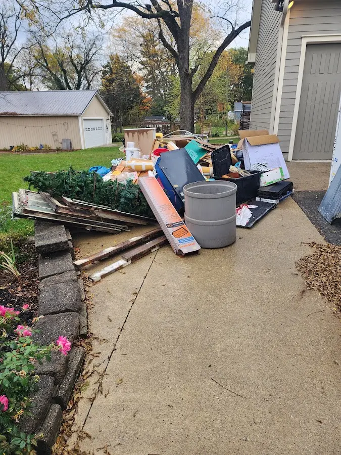 Dumpster being loaded with debris for Commercial Dumpster Rental in Crystal Springs
